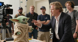 TIL Werner Herzog convinced Jon Favreau and Dave Filoni to keep Grogu as a puppet instead of CGI on the set of "The Mandalorian." After watching them shoot a take without the puppet to allow a CGI replacement in post-production, Herzog told them, "You are cowards. Leave it."